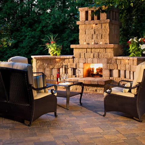 stone fireplace paver patio Texas backyard