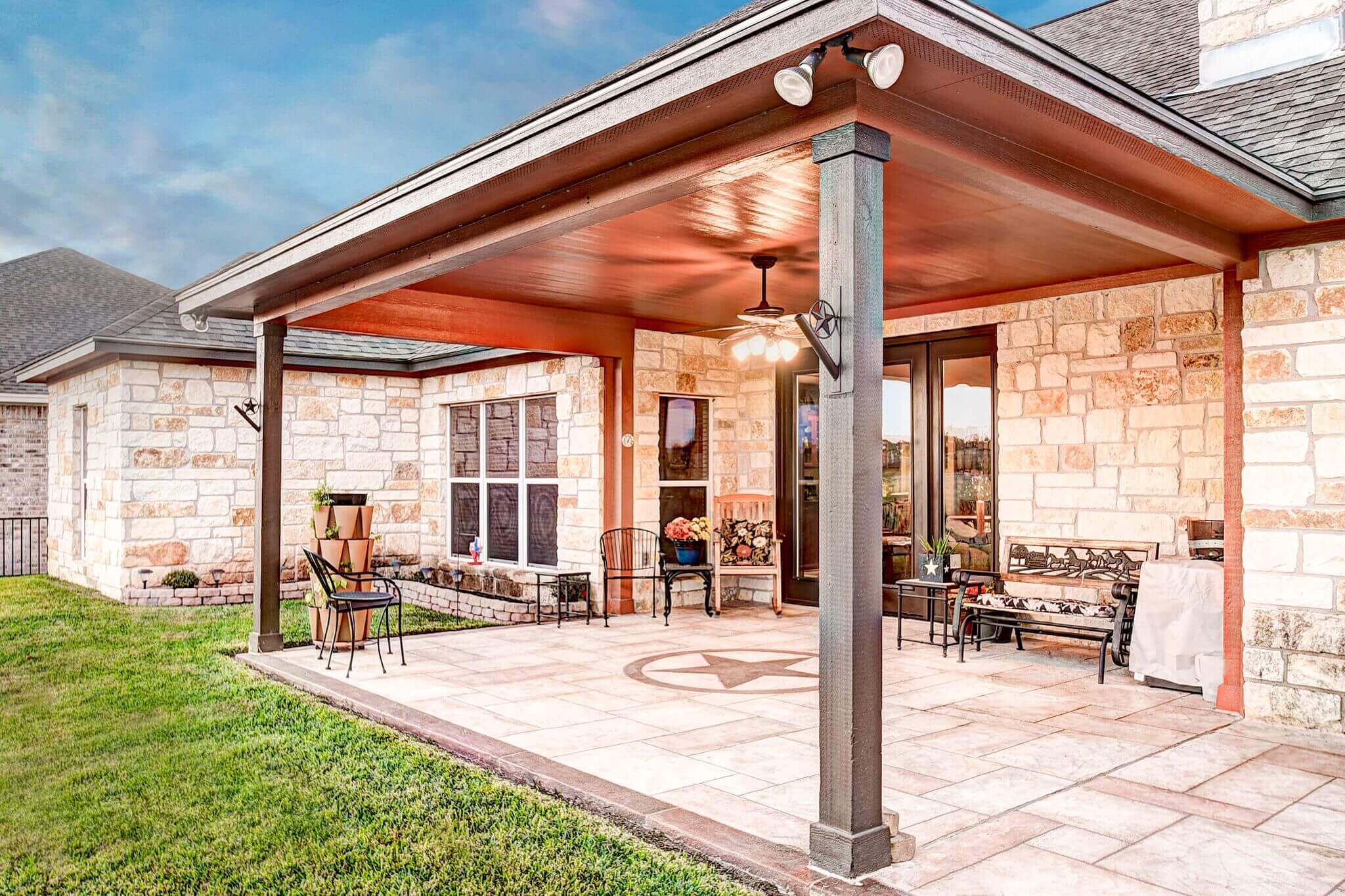 Backyard patio cover and carvestone with design
