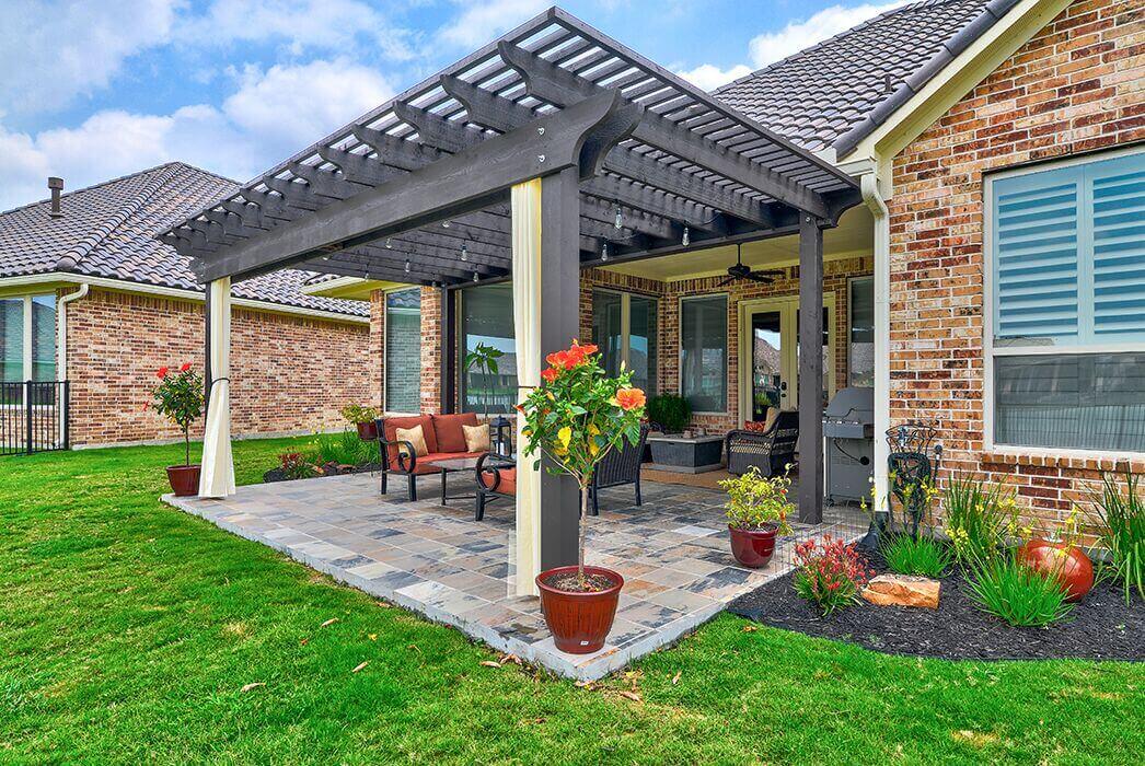 Backyard pergola design and paver patio idea