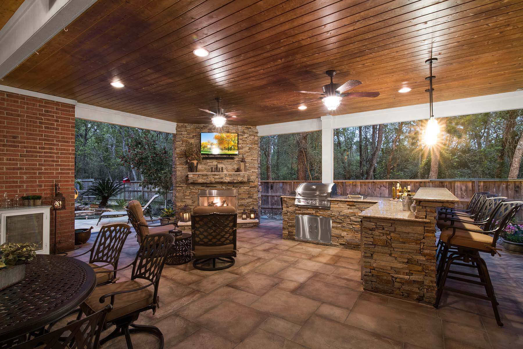 Outdoor living room and patio cover with kitchen and tv mount.
