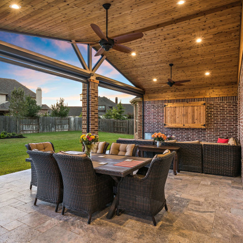 Backyard covered patio with cedar detailing and screens