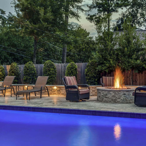 Custom pool build and firepit seating area