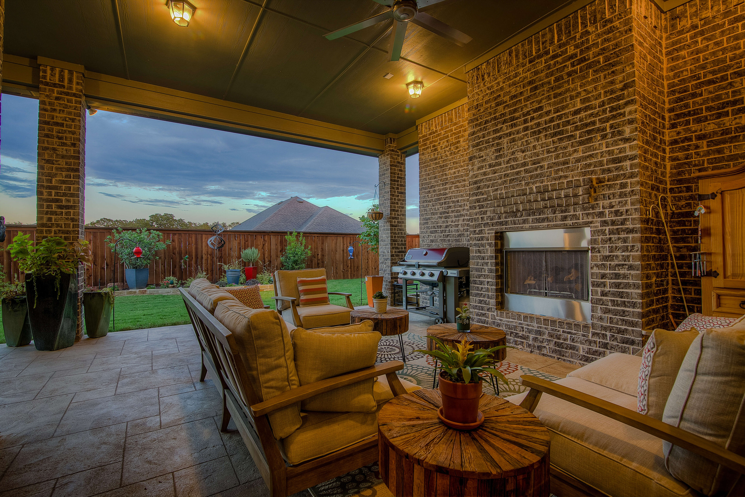 Inviting patio space with grill area and fireplace