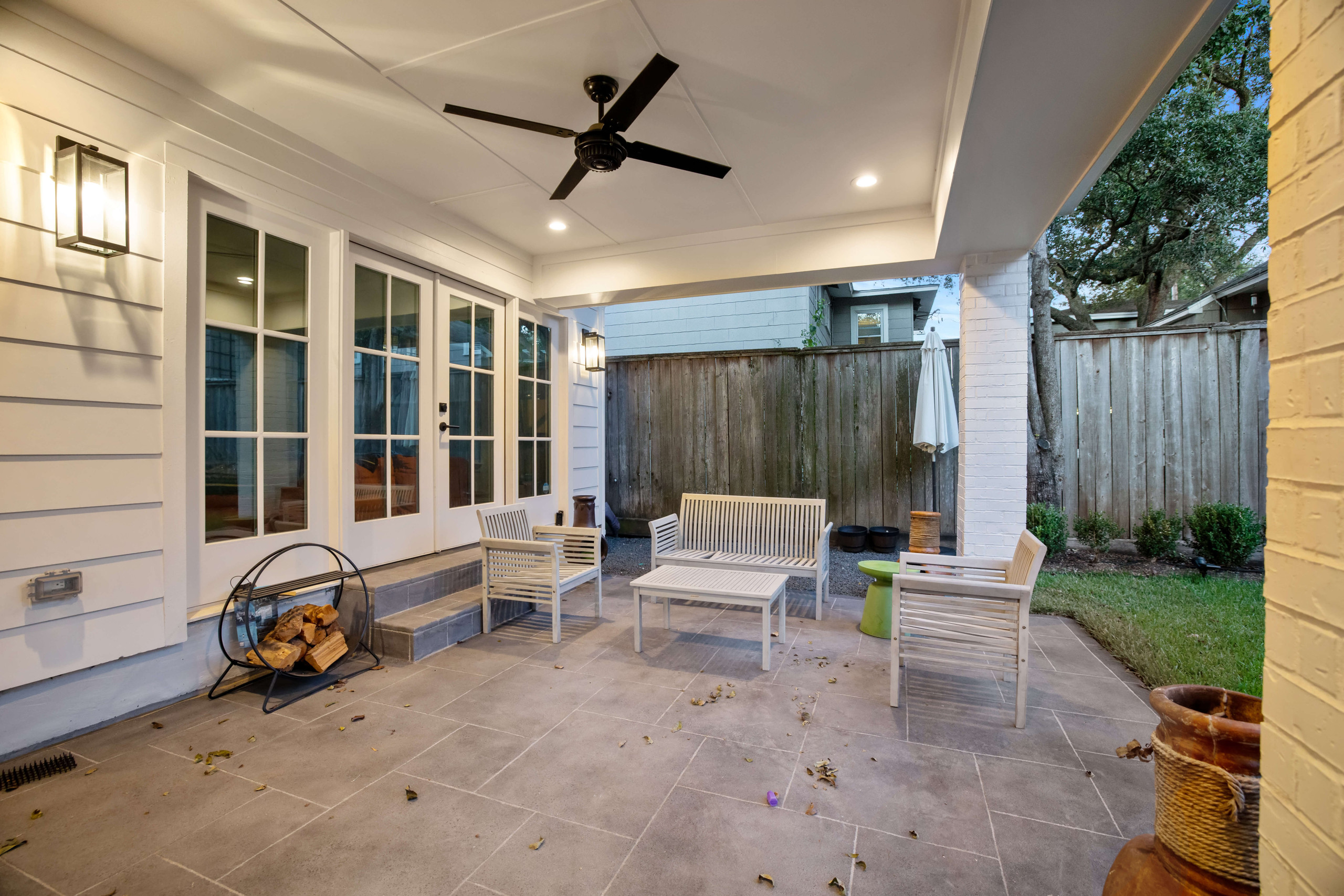 Modern white patio cover ceiling and grey carvestone patio flooring