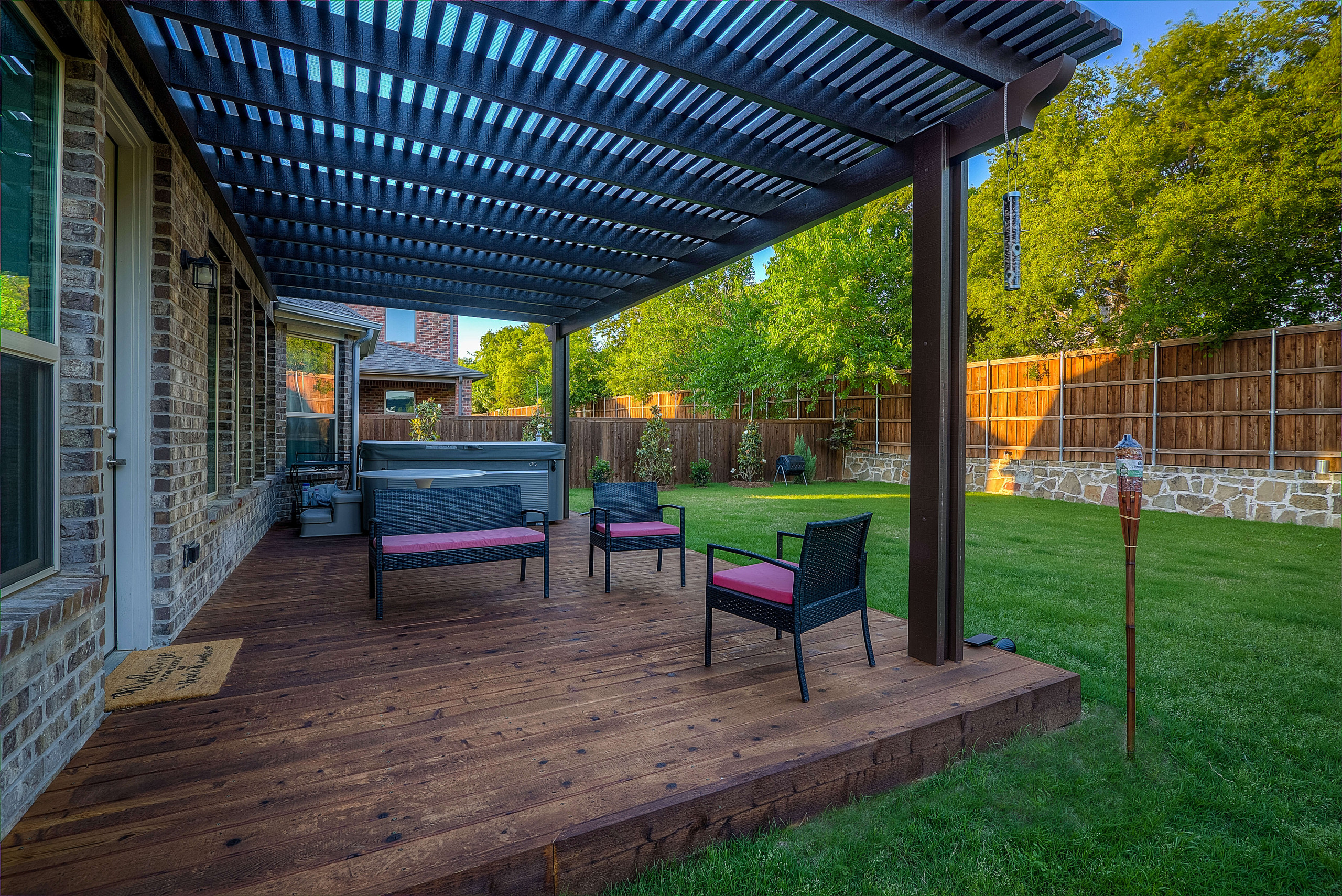 Backyard pergola and wooden deck for partial shade