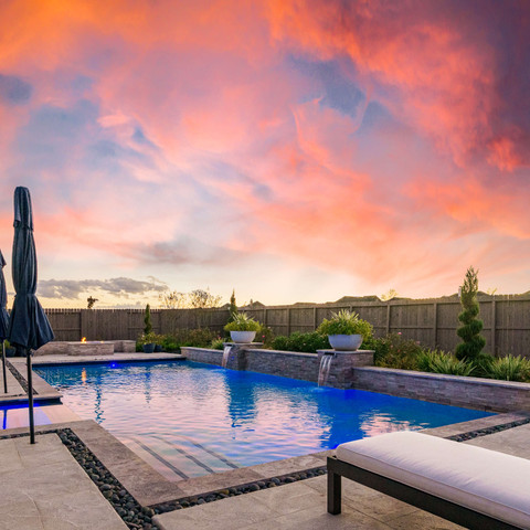 Backyard oasis pool deck Texas sunset outdoor living
