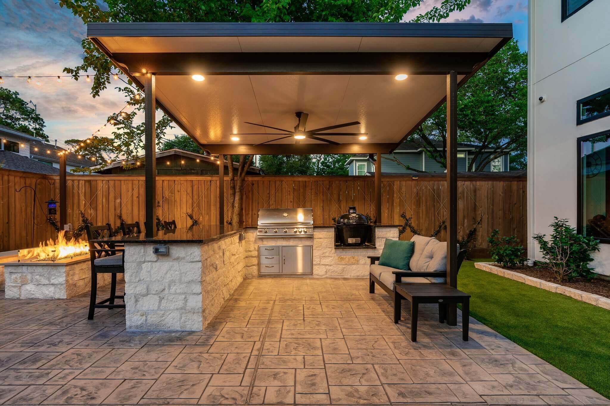 Aluminum patio cover with grilling station countertop and stamped concrete patio design idea