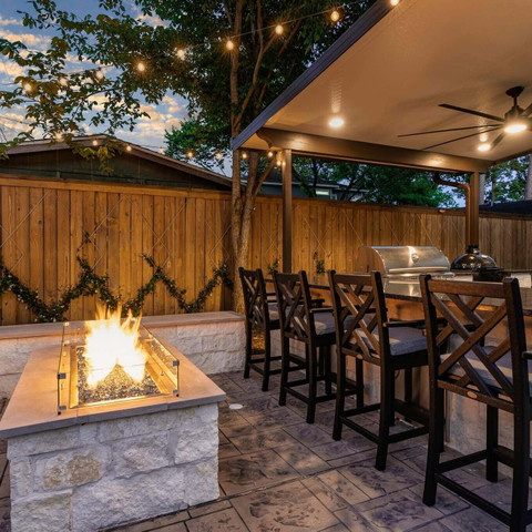 Backyard renovation retreat firepit design idea and outdoor kitchen space Houston Texas