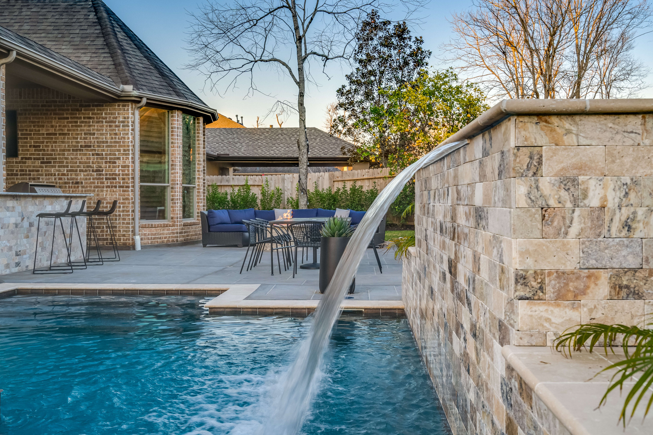 Luxurious water fountain feature in custom pool build