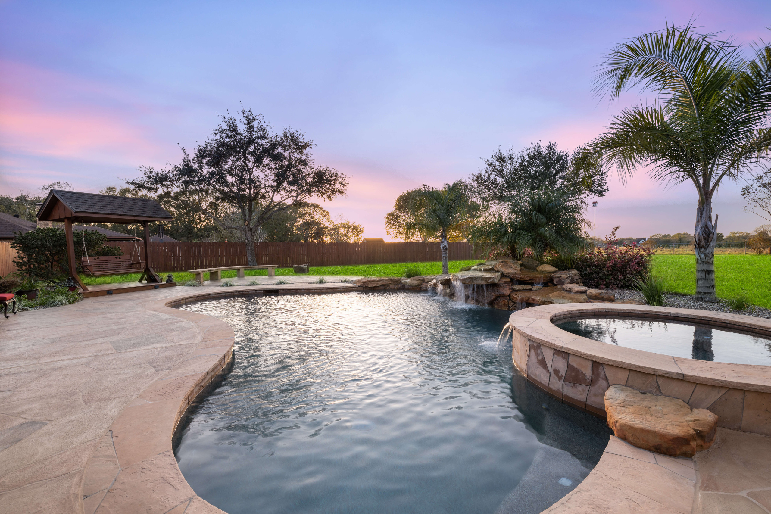Inground pool retreat remodel construction backyard Texas sunset views