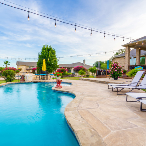 Backyard pool remodel carvestone pool decking in San Antonio Texas