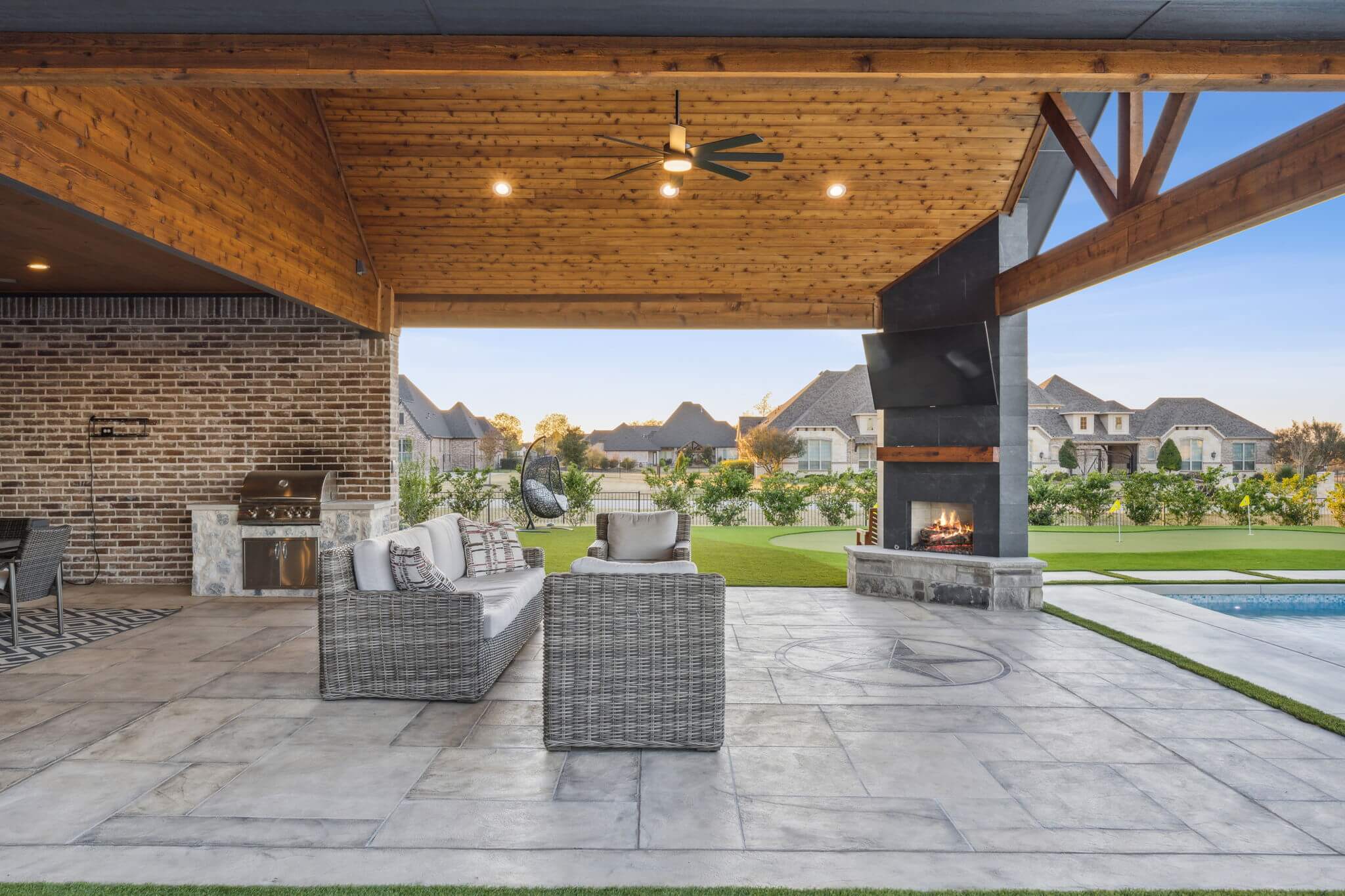 Outdoor living patio carvestone flooring and fireplace custom built
