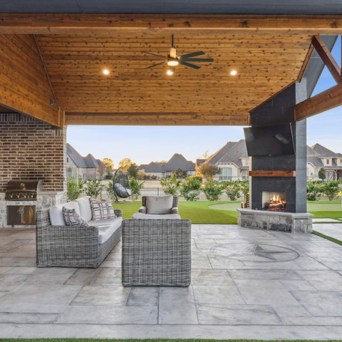 Outdoor living patio carvestone flooring and fireplace custom built