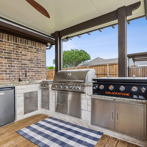 outdoor kitchen stone masonry details on backyard deck