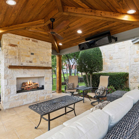 custom built patio cover stone fireplace fire feature backyard