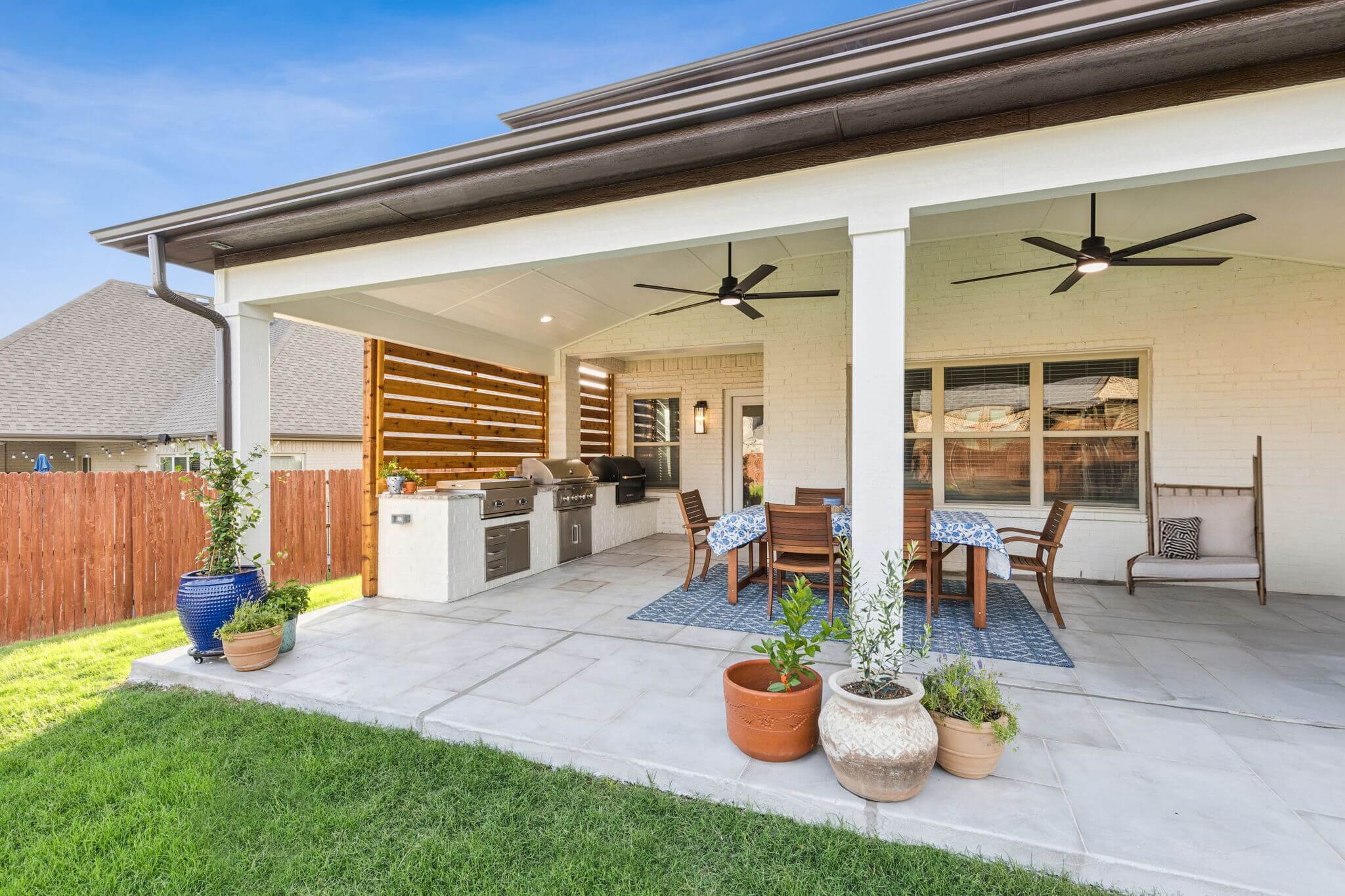 outdoor kitchen cedar privacy wall custom carvestone overlay