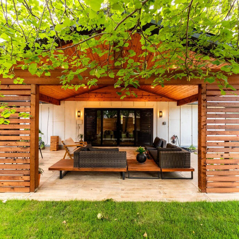 cedar shade structure patio privacy wall carvestone overlay