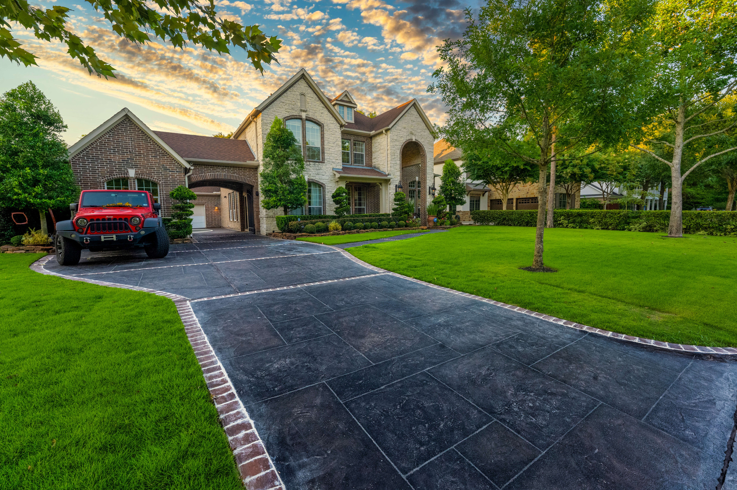 Updated driveway with decorative carvestone concrete overlay Houston Texas
