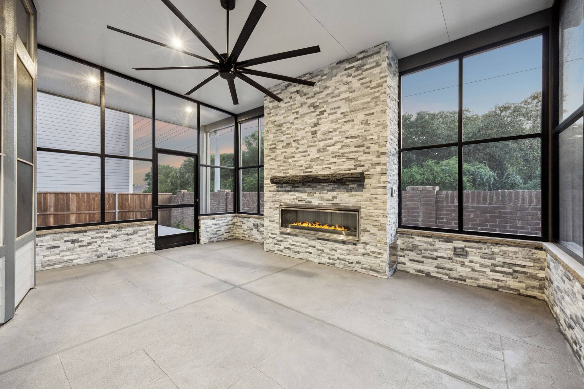 stone fireplace gray carvestone overlway patio screens aluminum patio cover