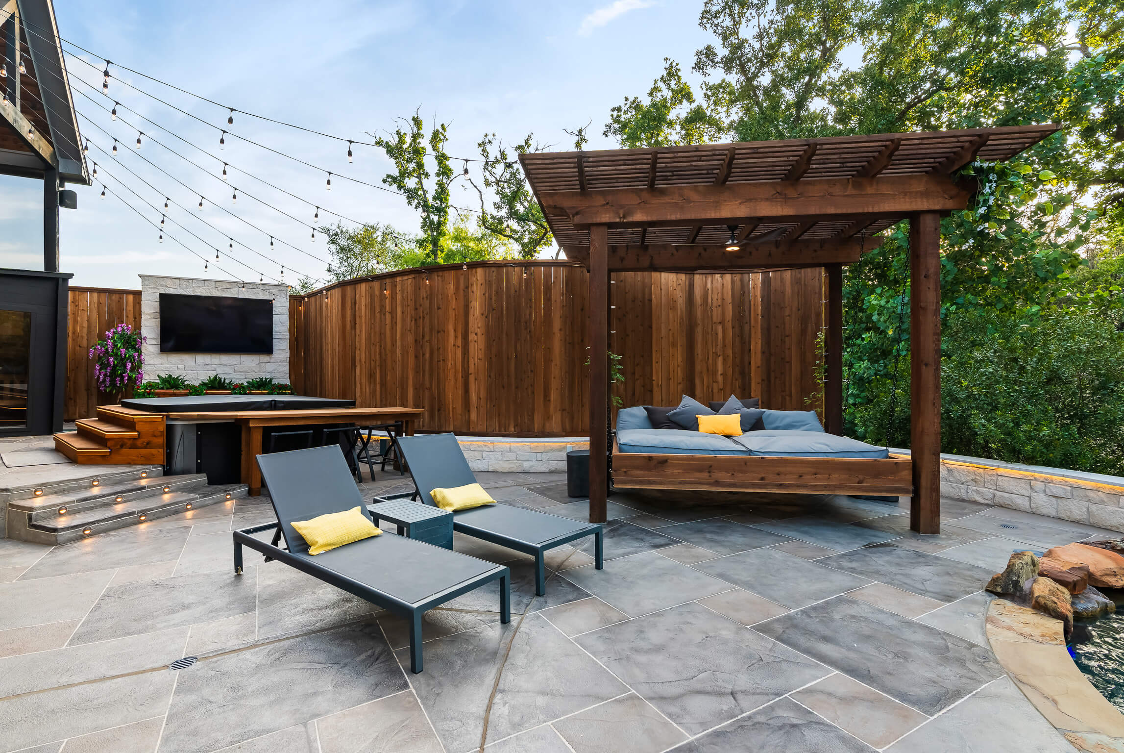 custom carvestone overlay patio pergola stone wall shade structure