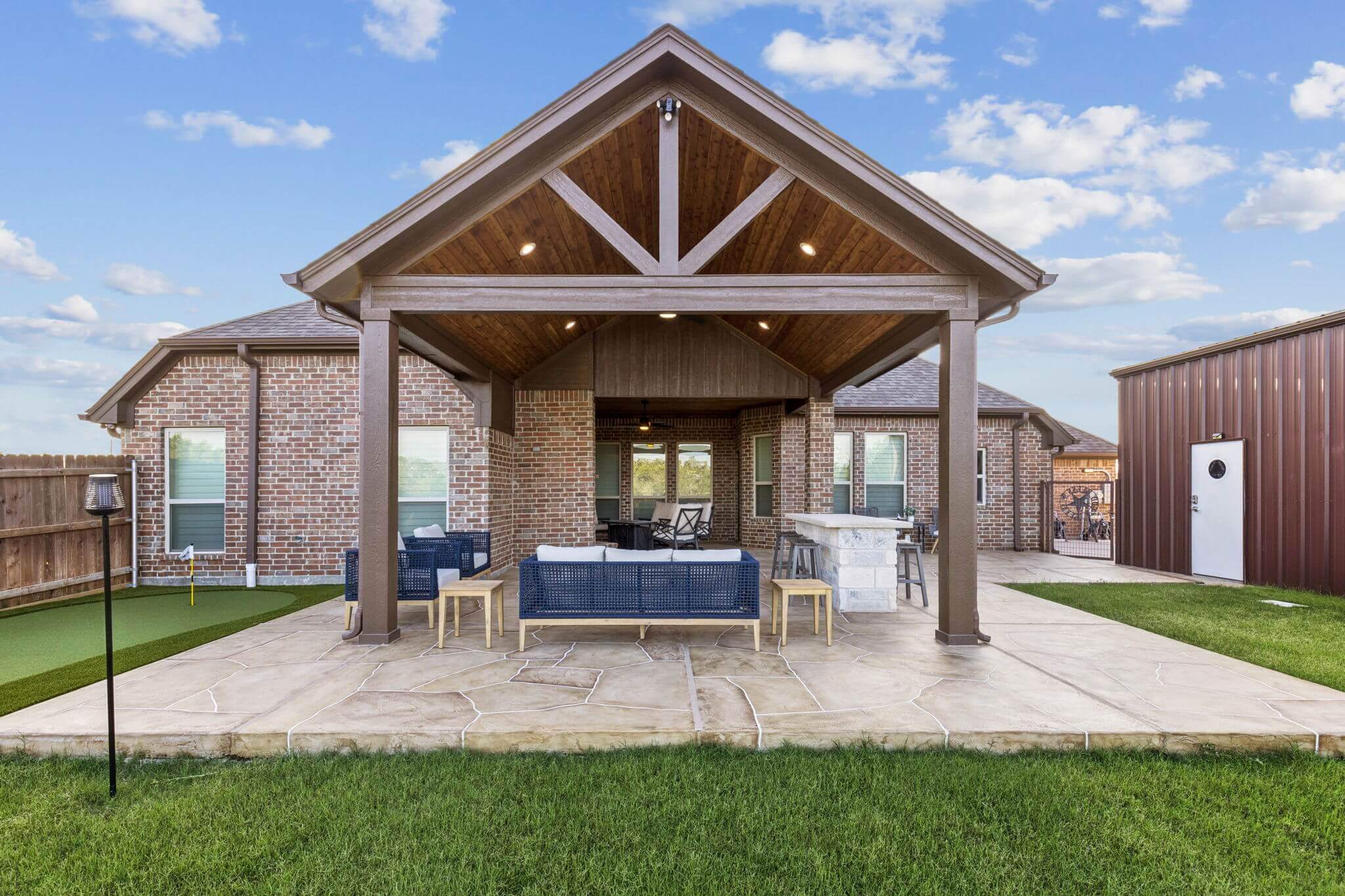 gable patio cover carvestone overlay patio fireplace outdoor kitchen