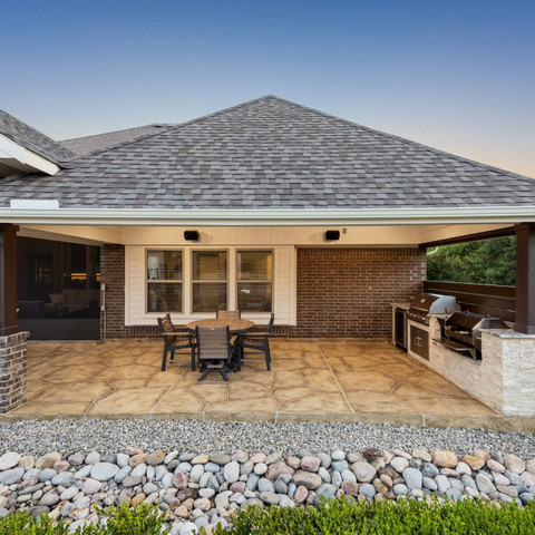 hip roof patio cover outdoor kitchen carvestone overlay