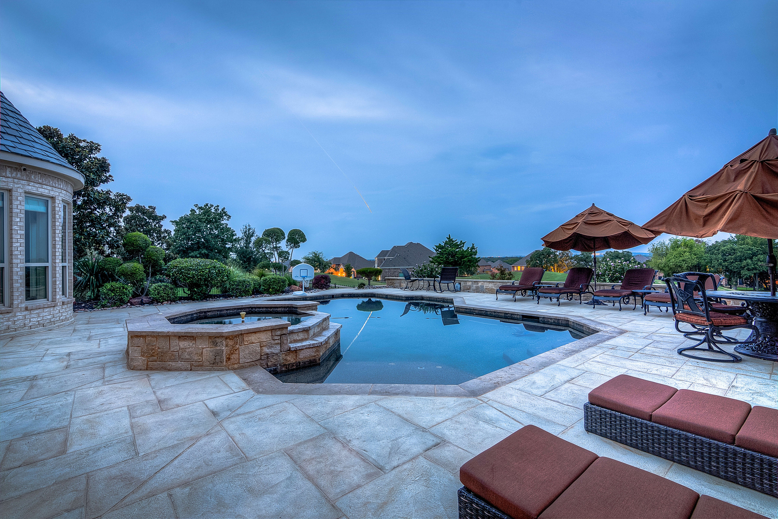 Concrete overlay product in Dallas Texas Carvestone hand-troweled pool deck