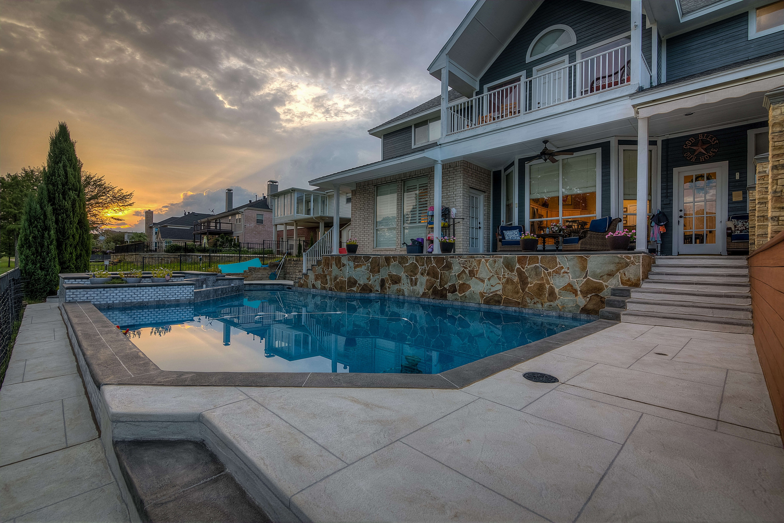 Carvestone pool deck design idea hand-troweled hardscape in Dallas Texas