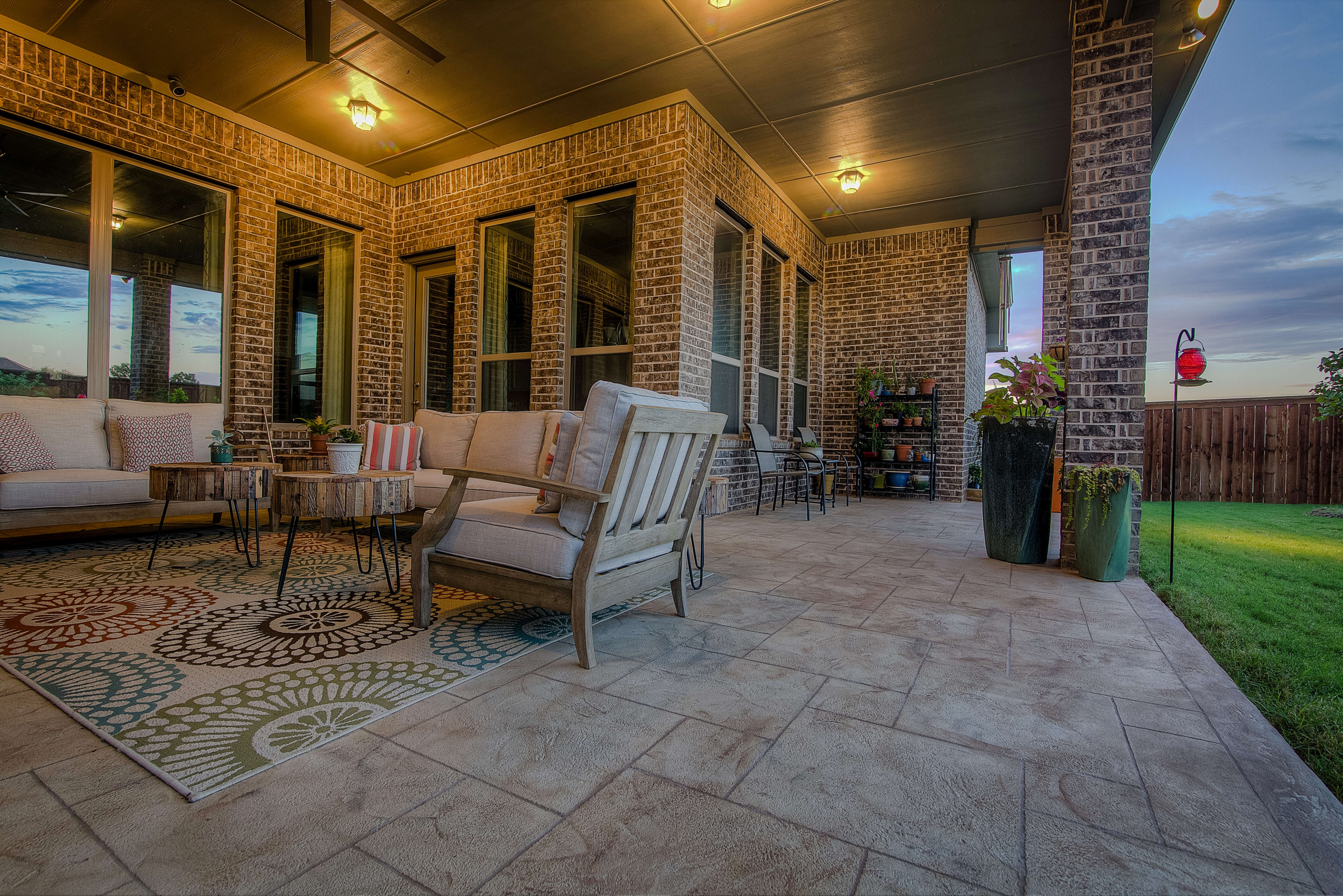 Backyard patio with Carvestone decorative concrete overlay design idea