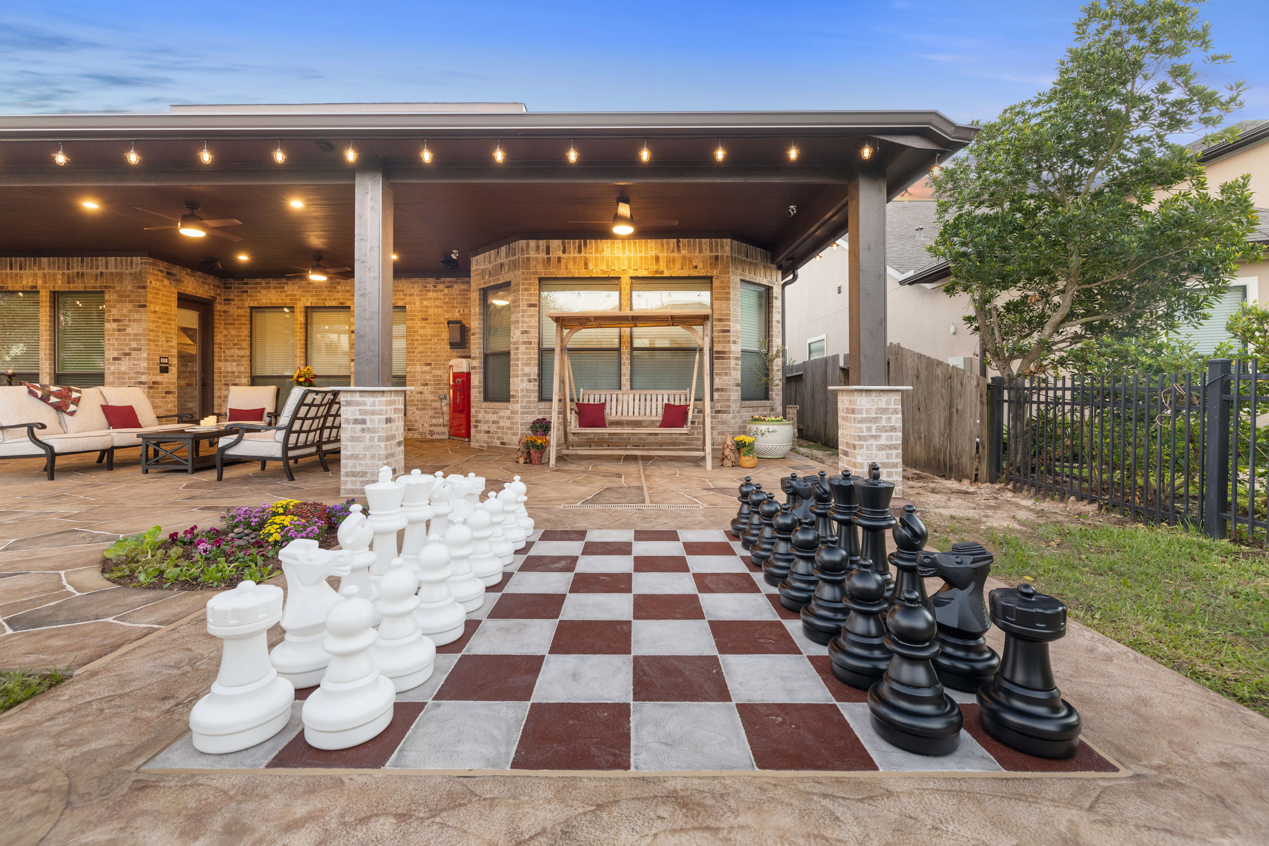 Carveston custom chess board on backyard patio hand-carved Houston Texas