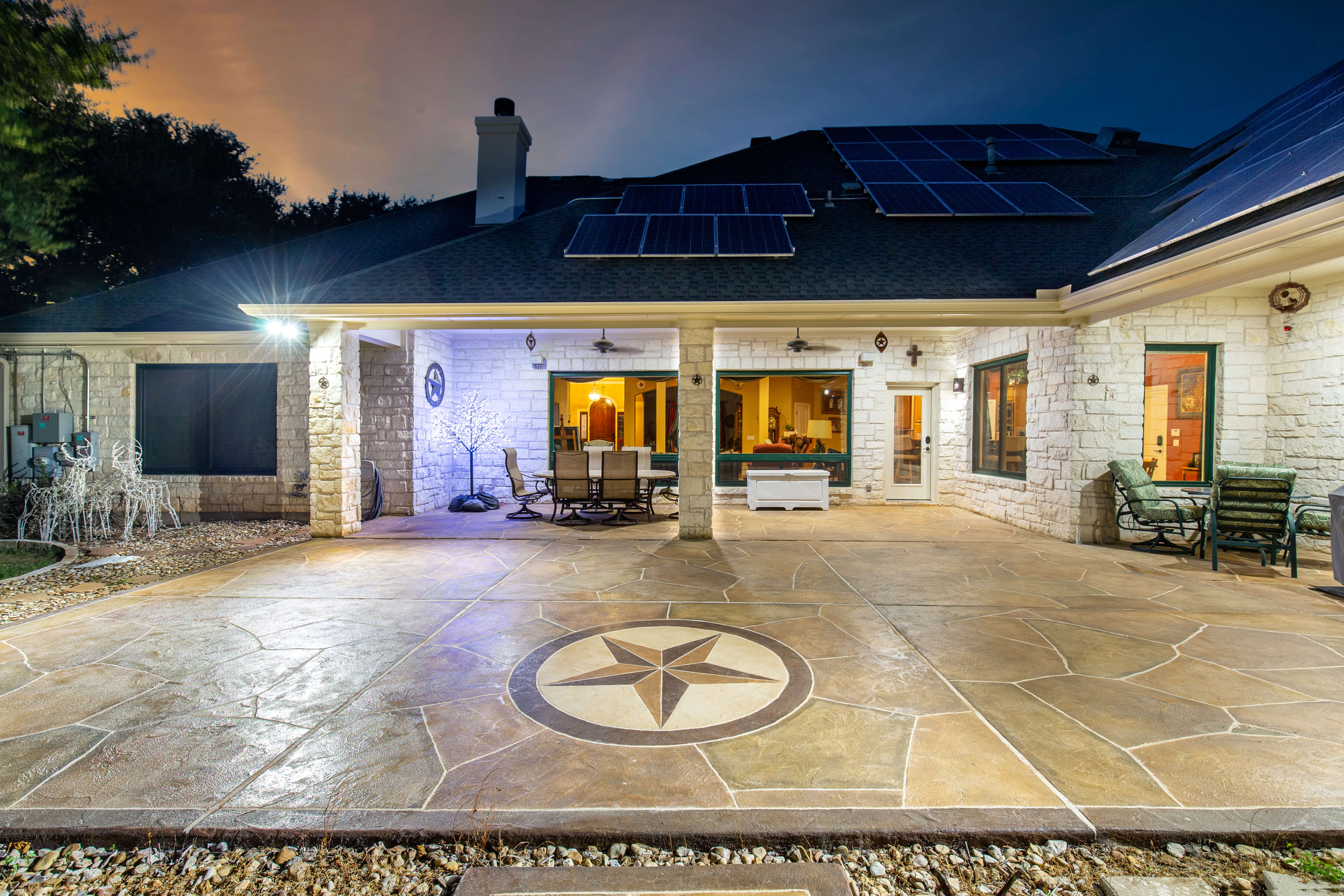 Custom carvestone texas star emblem patio design