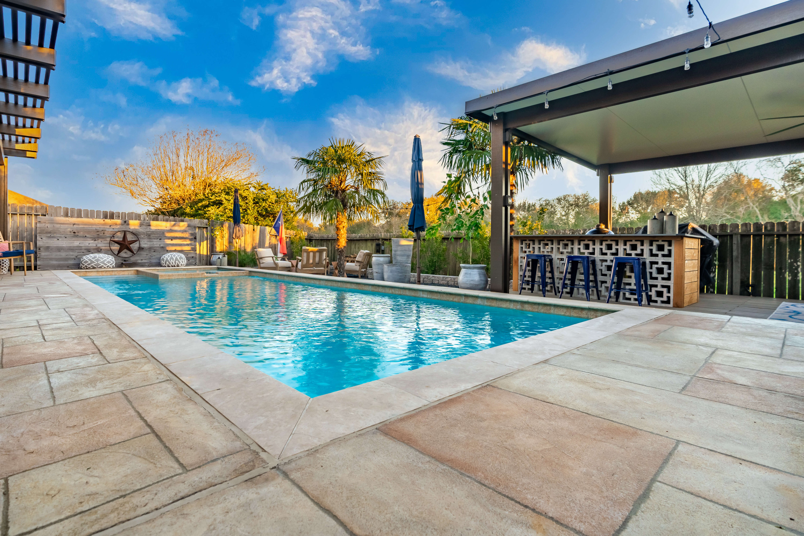 Tan custom colored pool deck design Carvestone concrete overlay Texas product