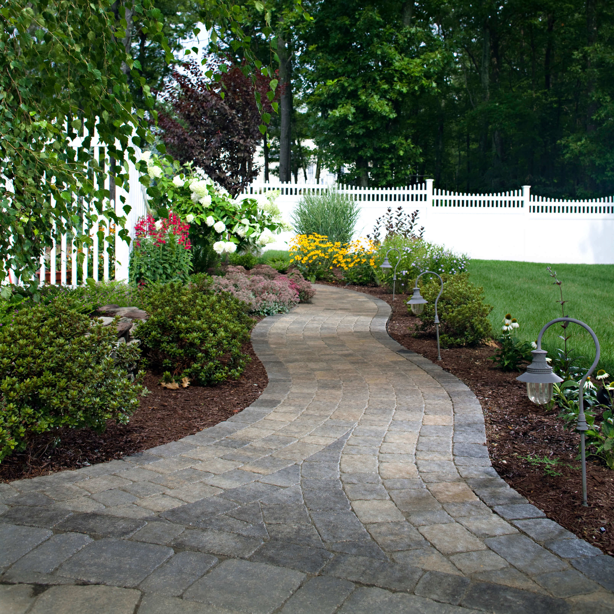 Paver hardscape backyard walkway landscaping