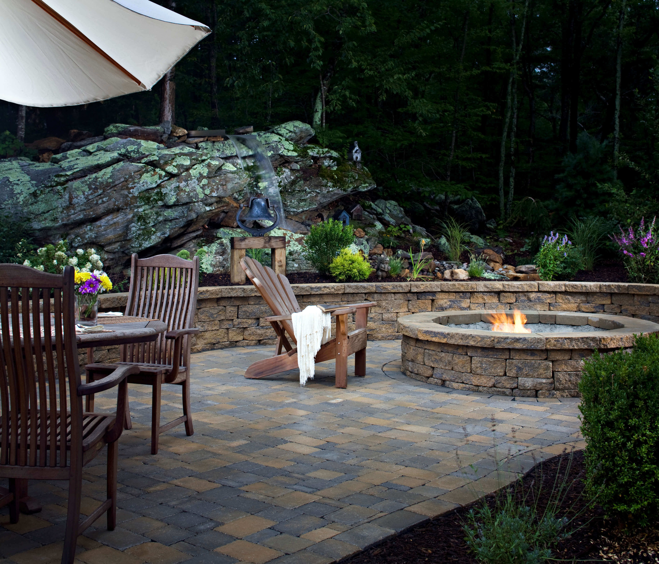 Paver patio and stone firepit built Dallas Texas backyard