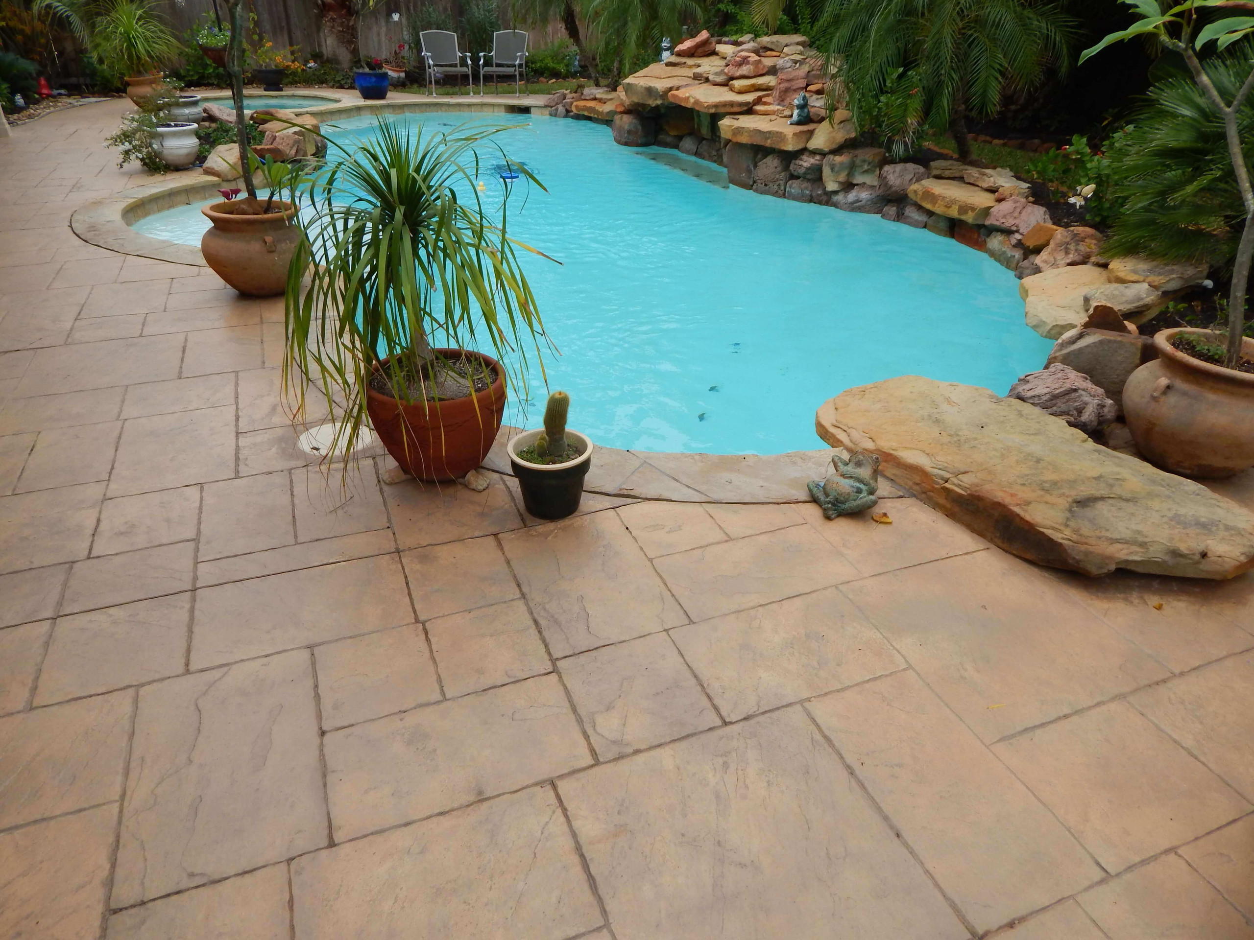 Stamped concrete pool decking in Texas decorative concrete hardscape