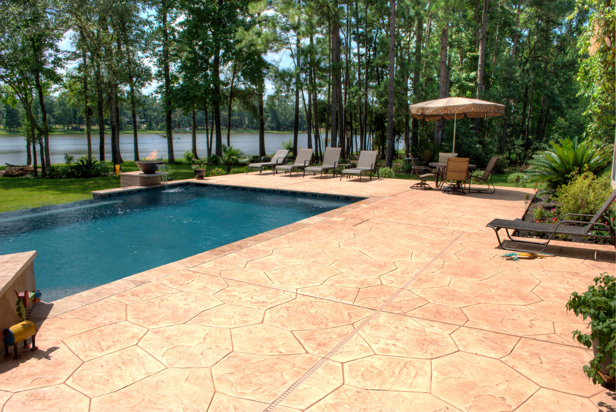 Decorative stamped concrete pool decking hardscape Houston Texas