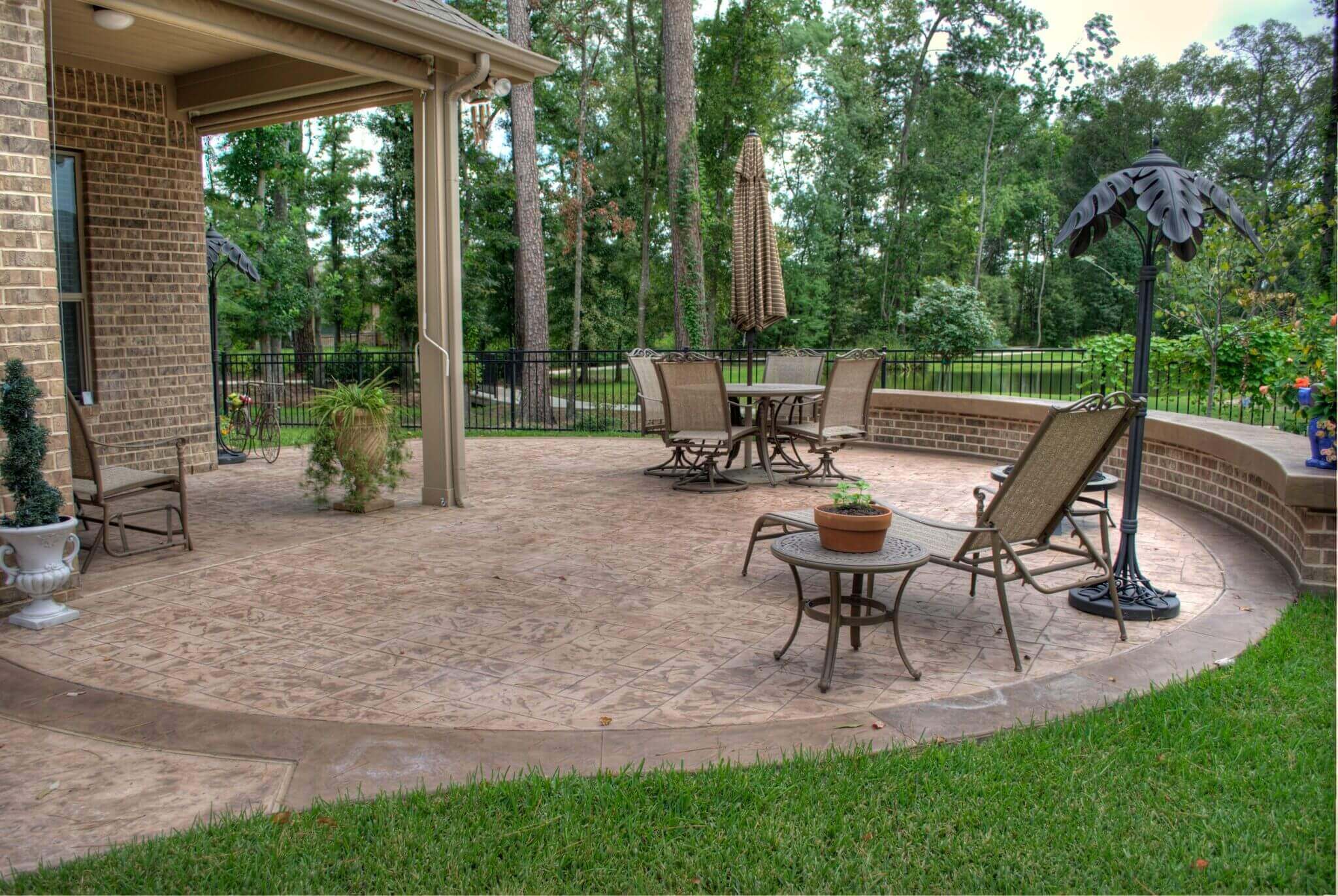 Hardscape backyard patio decorative stained concrete design idea