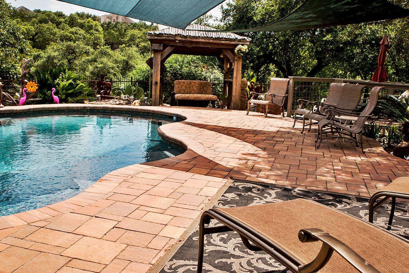 Custom stone paver pool decking hardscape design idea