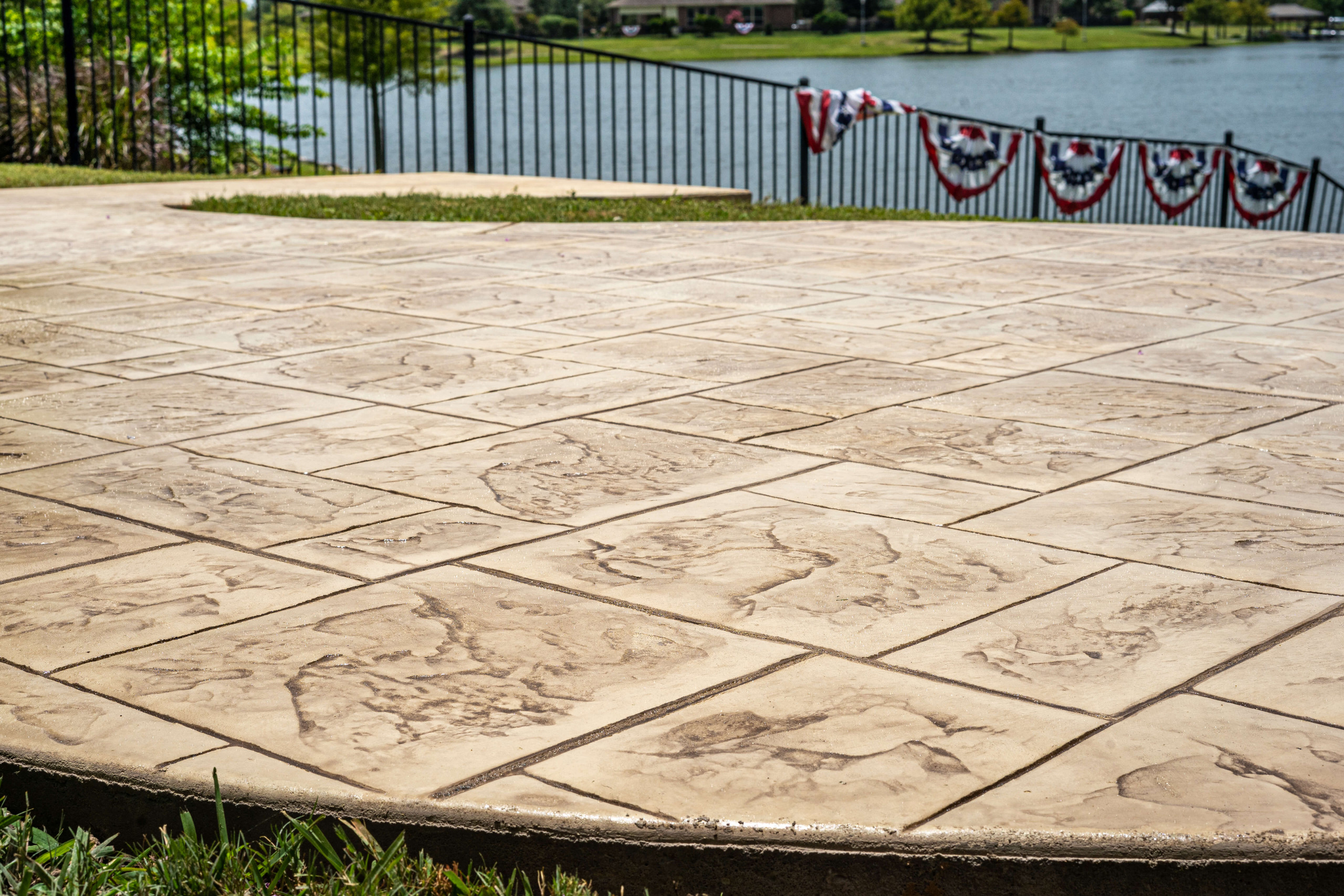 Stamped concrete patio tile design hardscape in Houston Texas