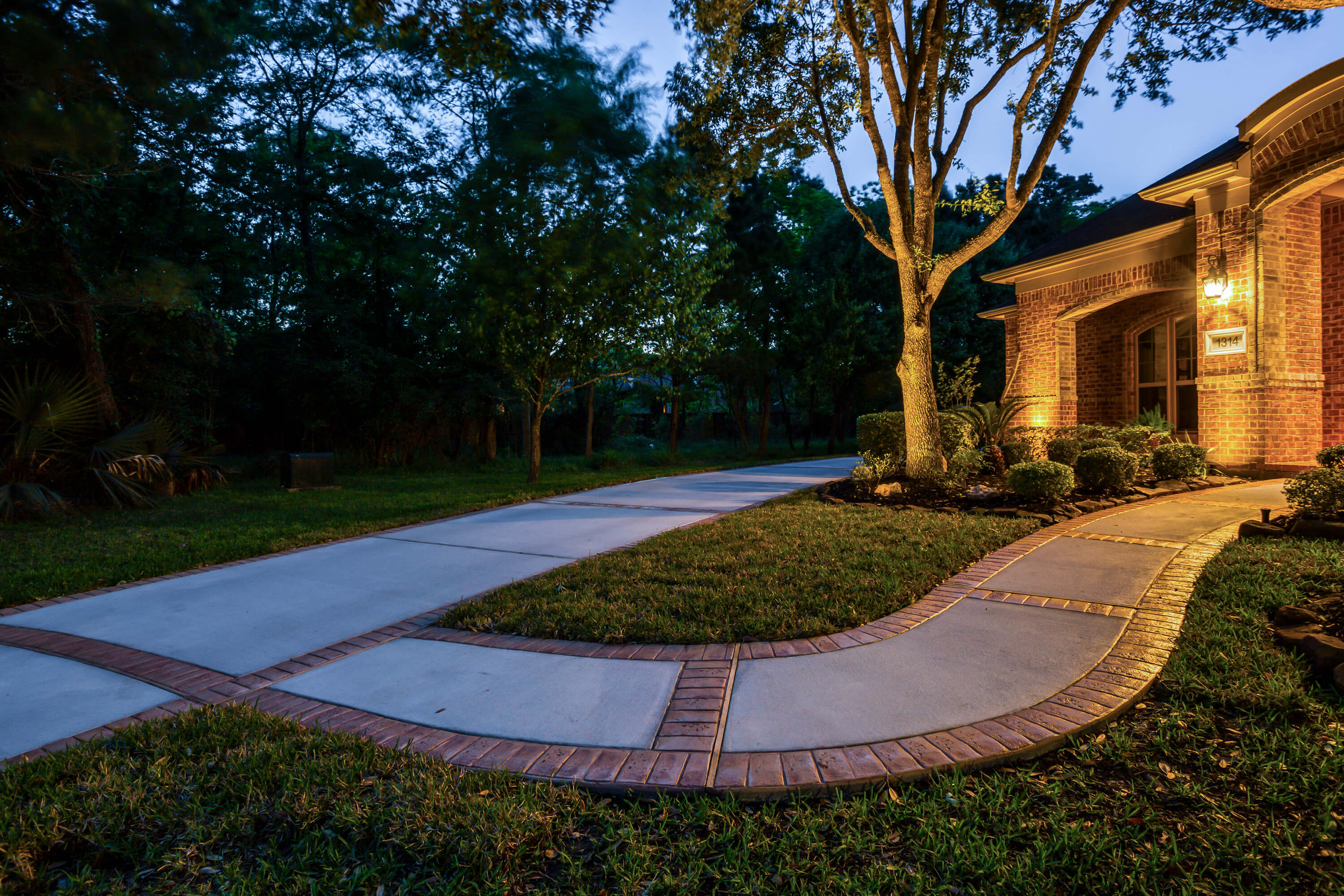 Poured concrete broom finished with brick border design