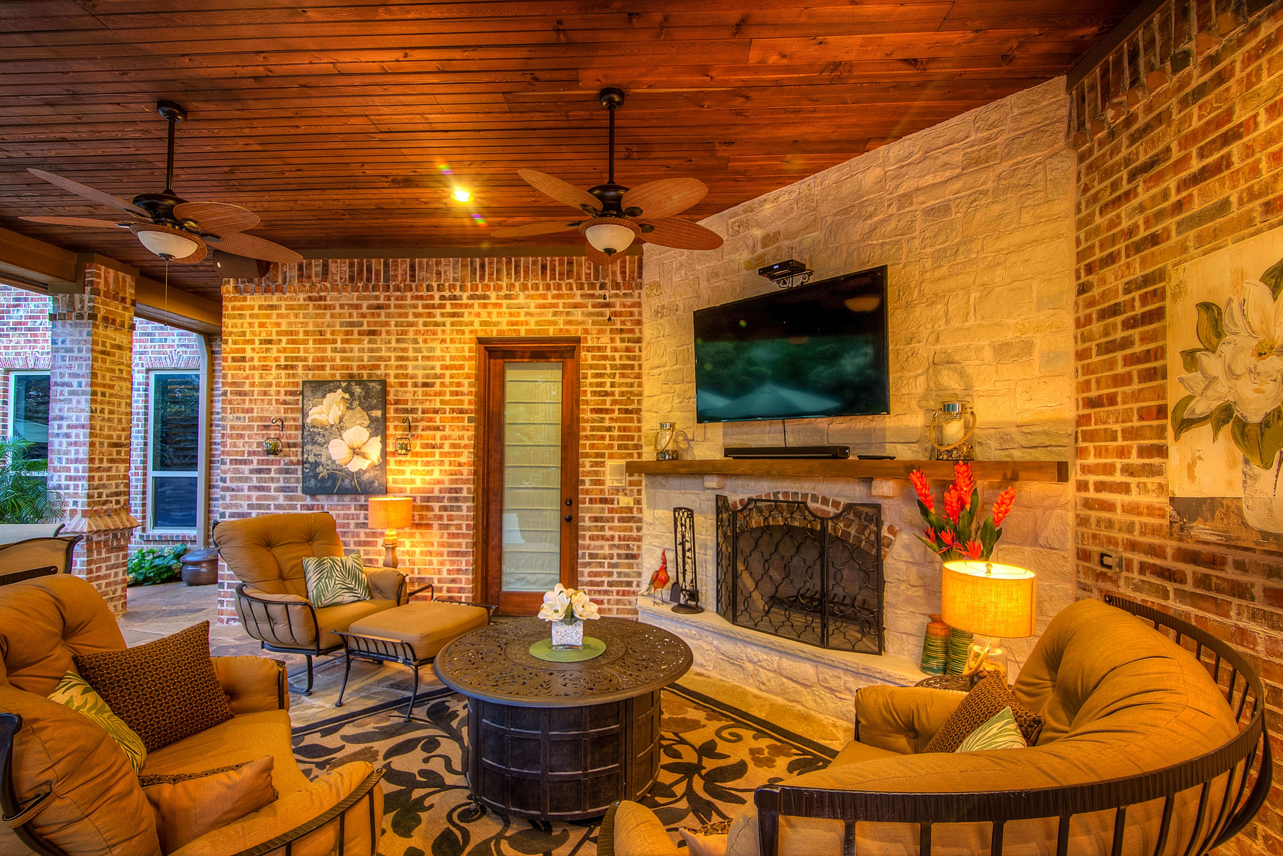 Cozy patio cover with fireplace and seating area