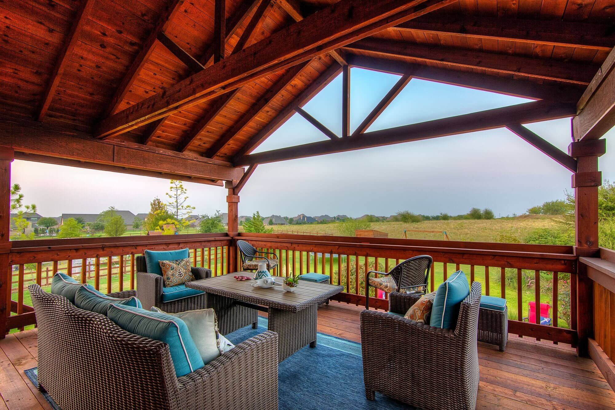 Covered patio with cedar detailing and seating area