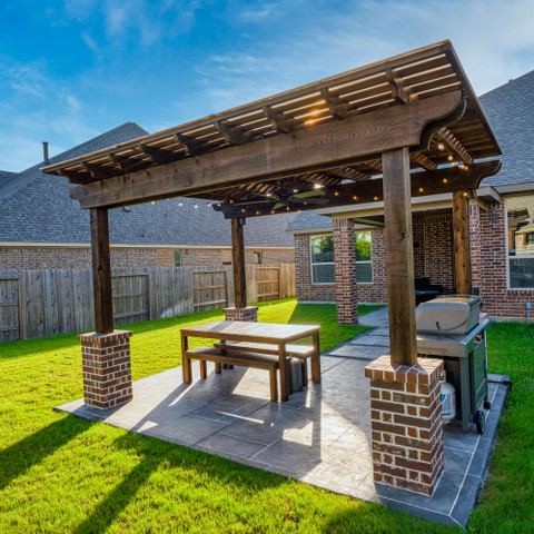 Wooden backyard pergola outdoor grill and dining space shade structure