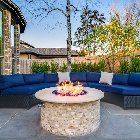 Custom stone firepit on the backyard patio