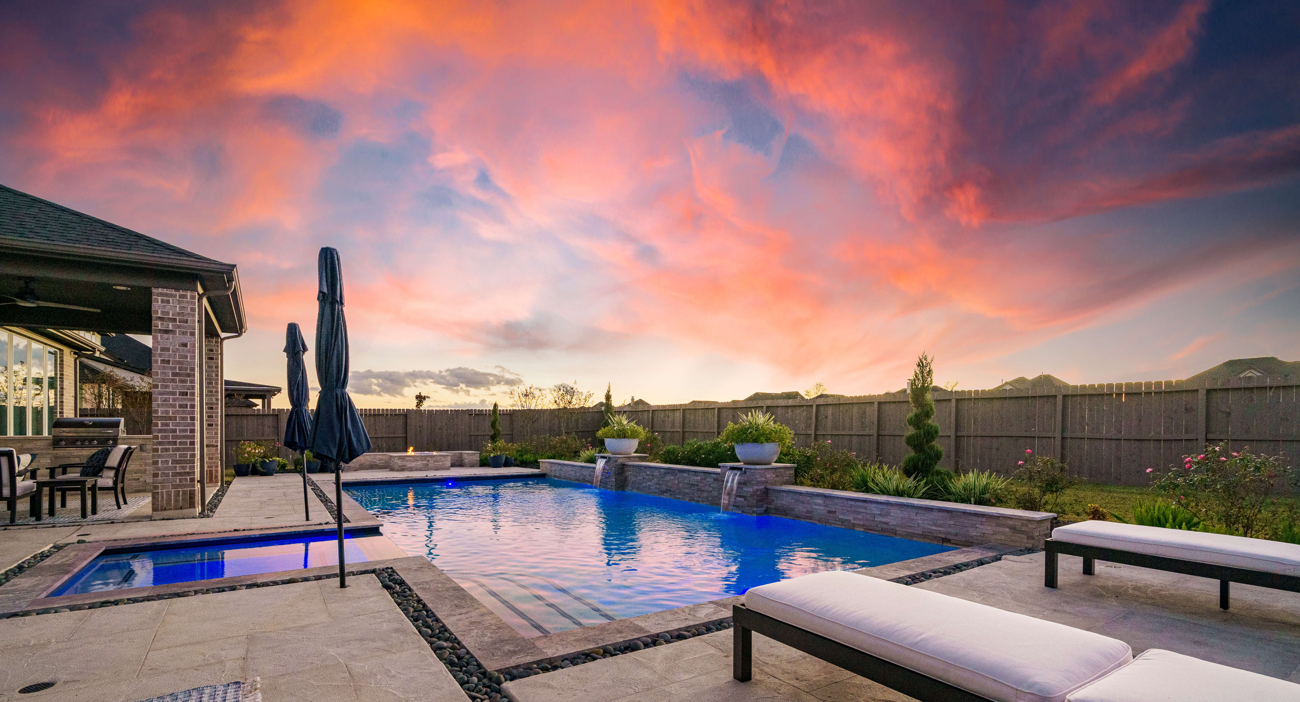 Backyard oasis pool deck Texas sunset outdoor living