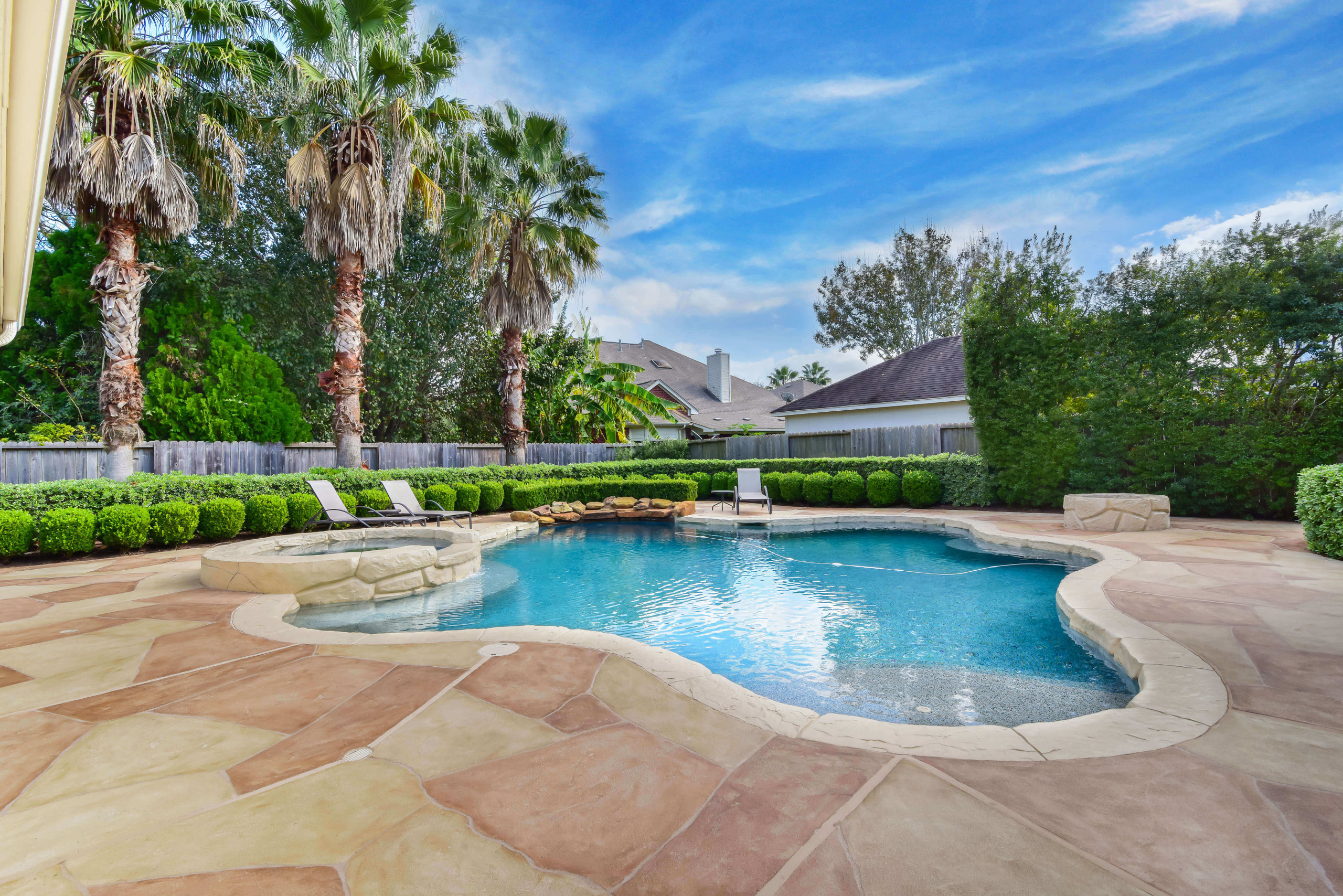 Custom pool remodel construction with carvestone pool decking