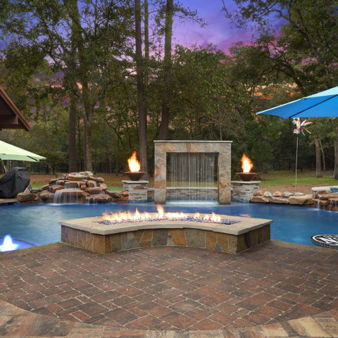 Pool remodel with fire feature and water fountain backyard design idea