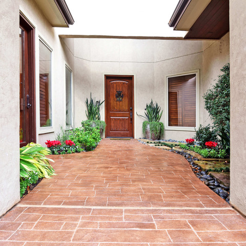 Updated walkway with carvestone concrete overlay in Dallas Texas