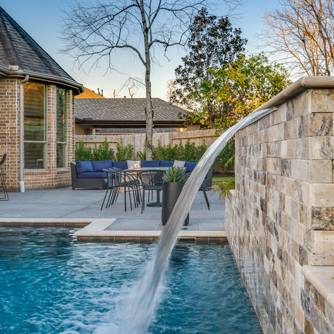 Luxurious water fountain feature in custom pool build