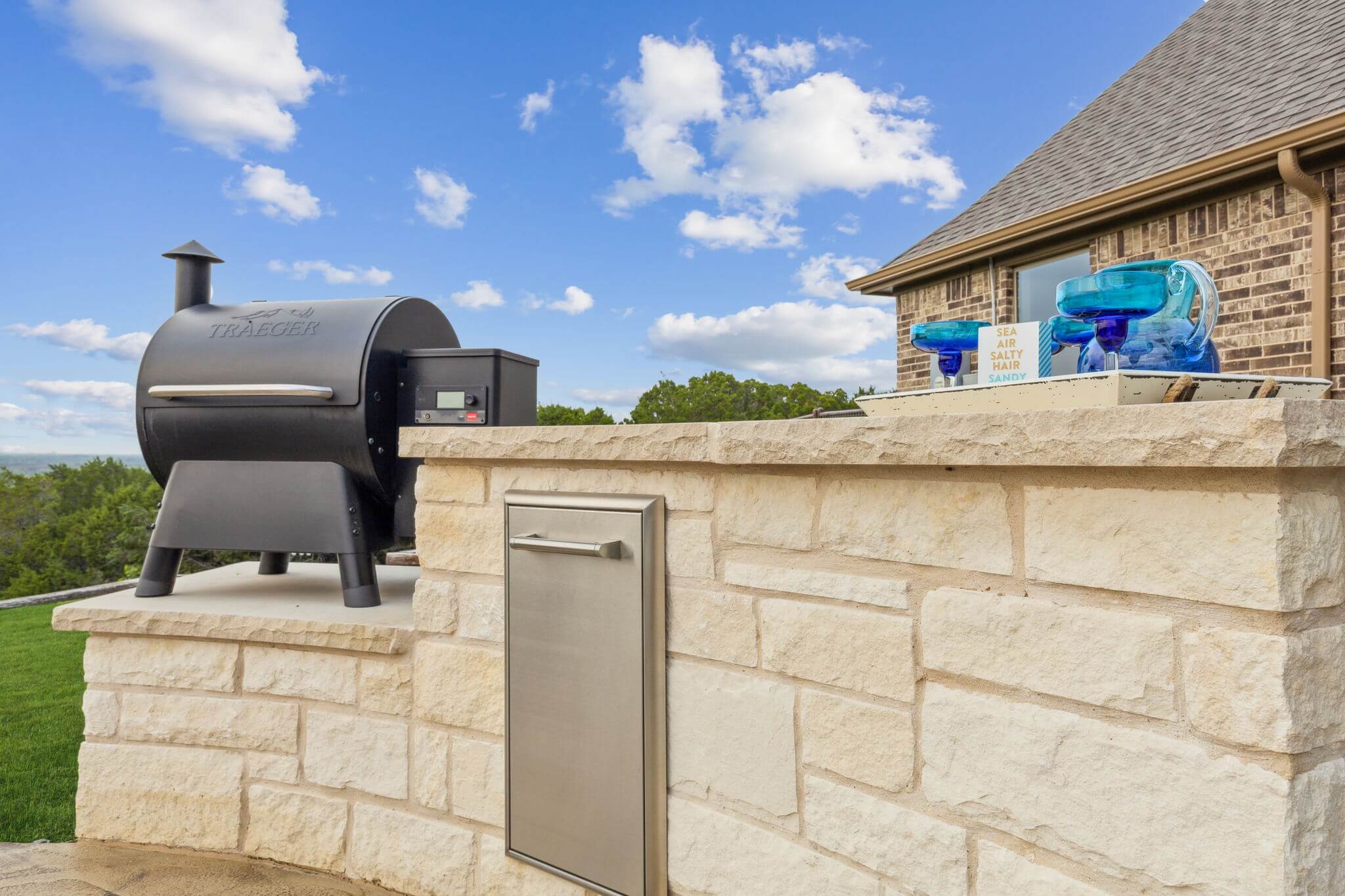 stone outdoor kitchen area custom built